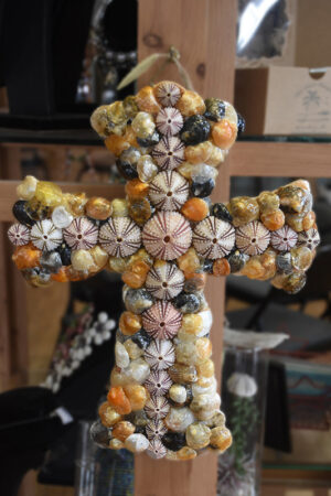 “Shell Cross” – Local shells mounted on wood